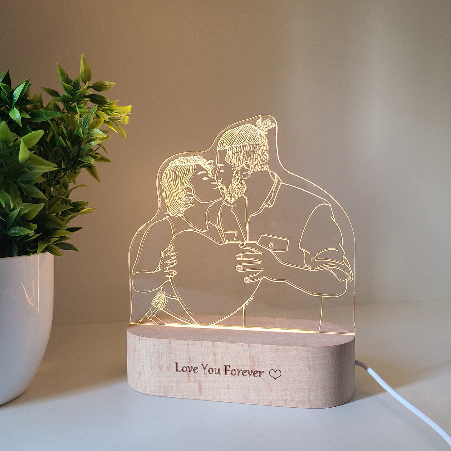 Custom LED photo lamp featuring a couple kissing, shown in daylight, highlighting the details in a close-up view.