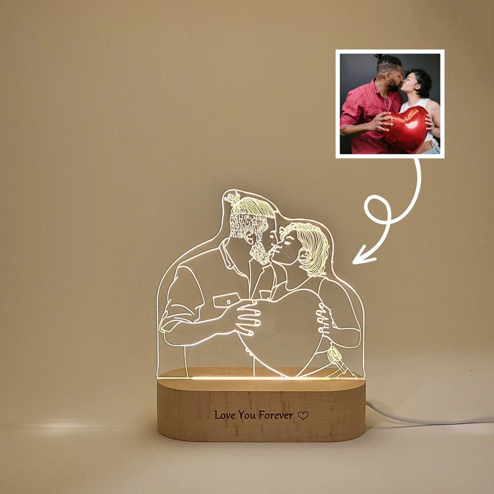 Custom LED photo lamp featuring a couple kissing. The image illustrates how a photo transforms into a lamp, showcasing the engraved design on an acrylic plate.