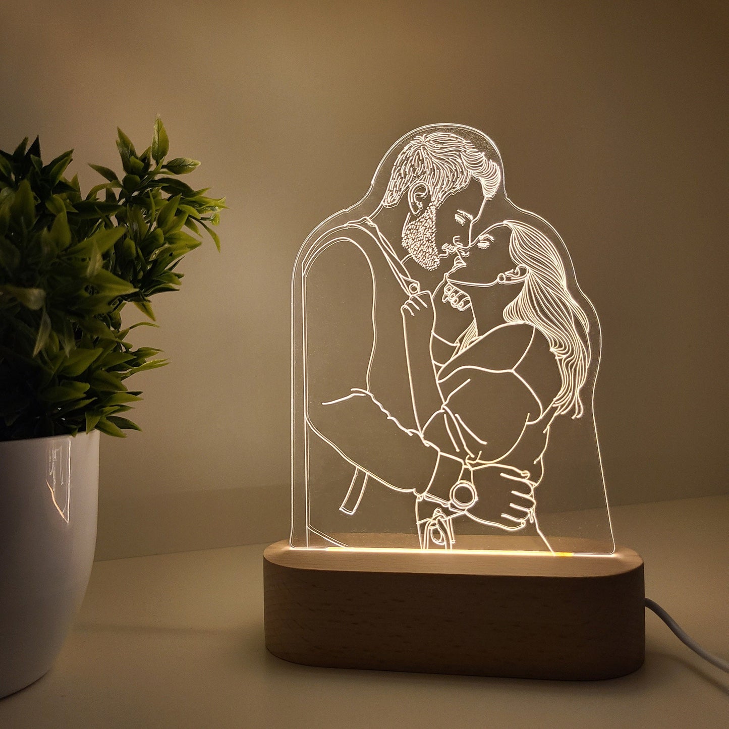 Individual 3D photo lamp featuring a couple embracing each other in soft lighting.