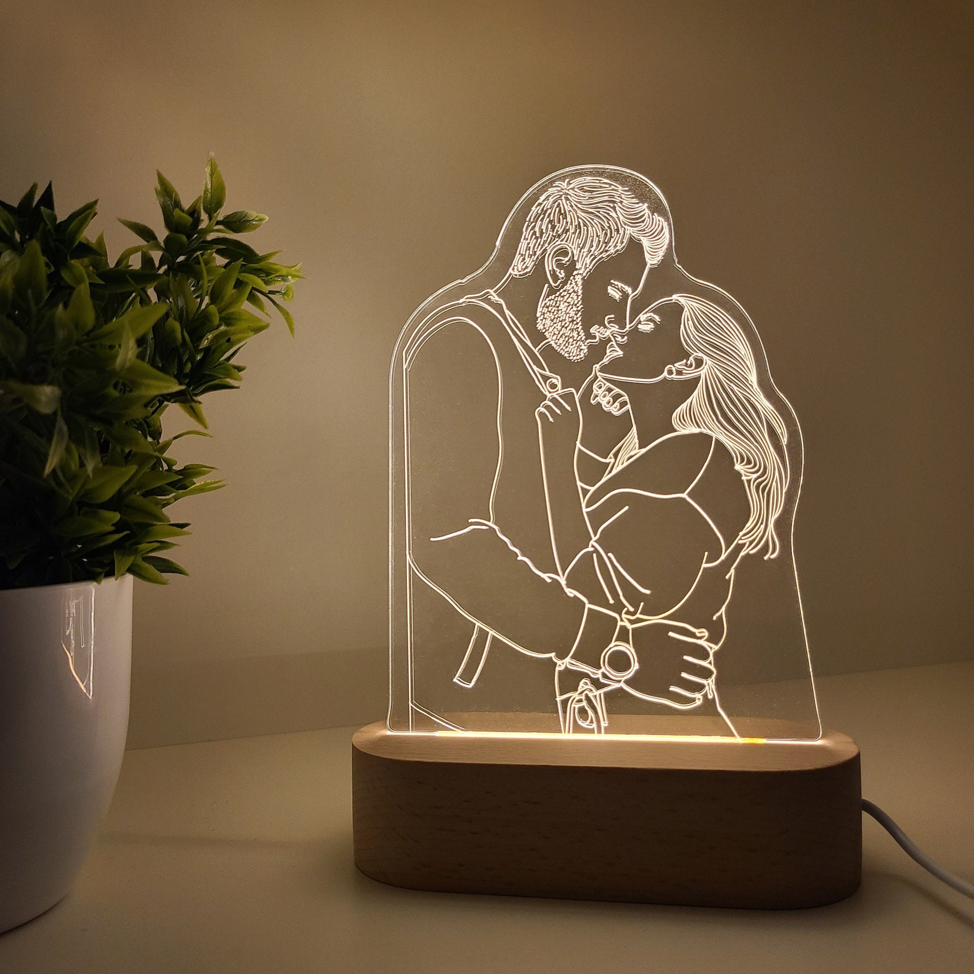 Individual 3D photo lamp featuring a couple embracing each other in soft lighting.