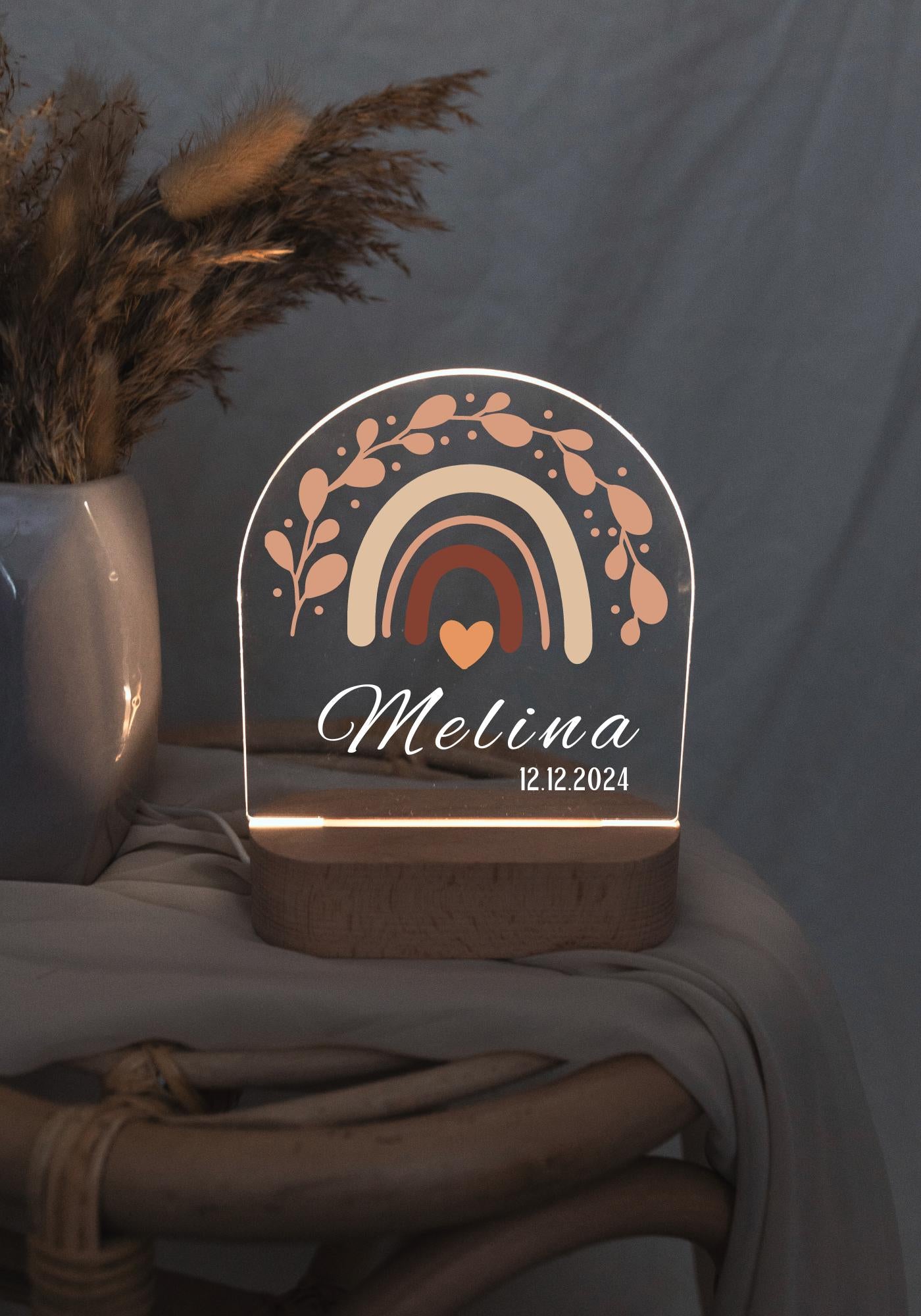 Personalised Rainbow Night Light for Baby,  displayed in low light.