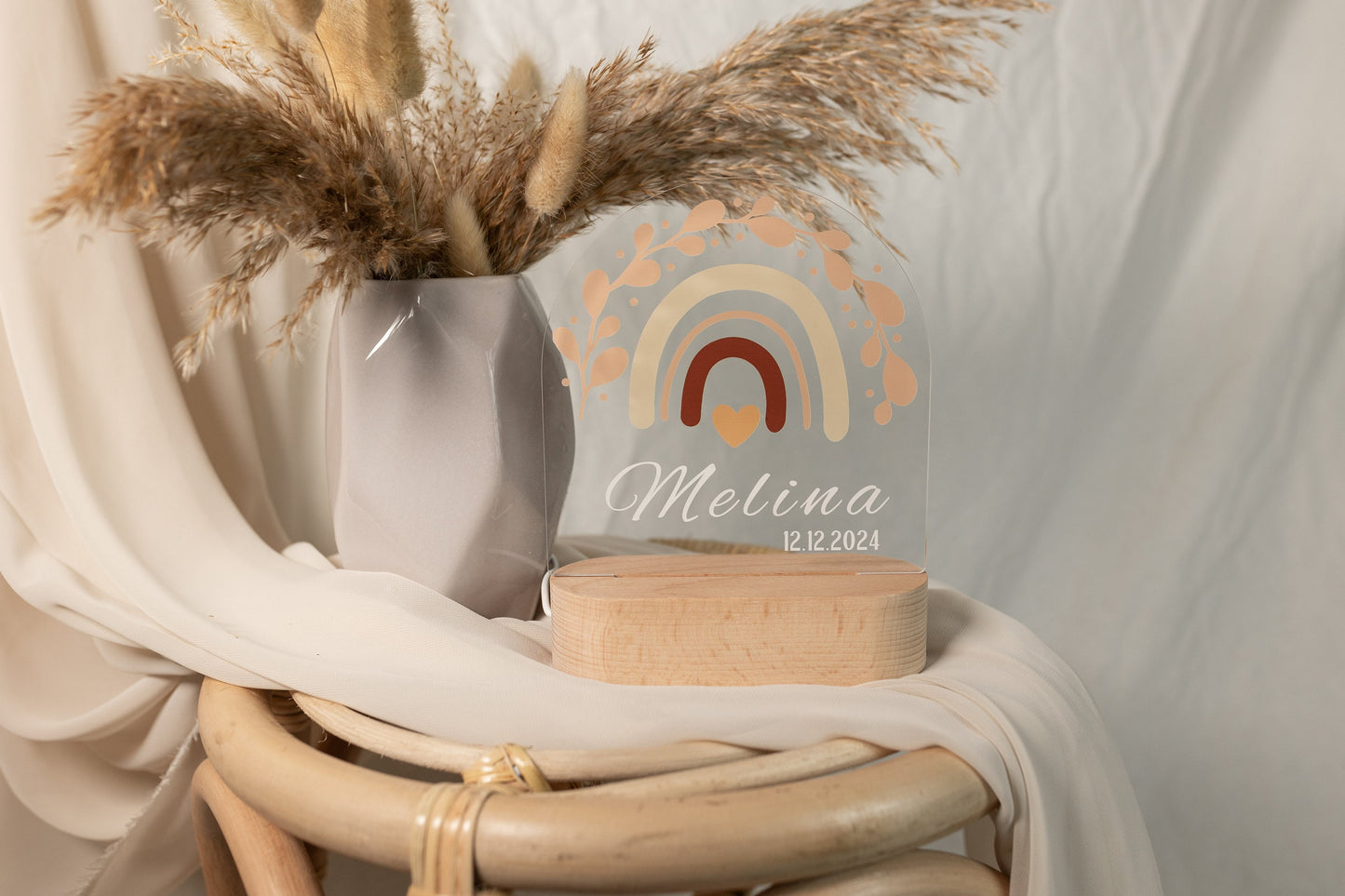 Personalised Rainbow Night Light for Baby, showcased in daylight against a boho-style background.