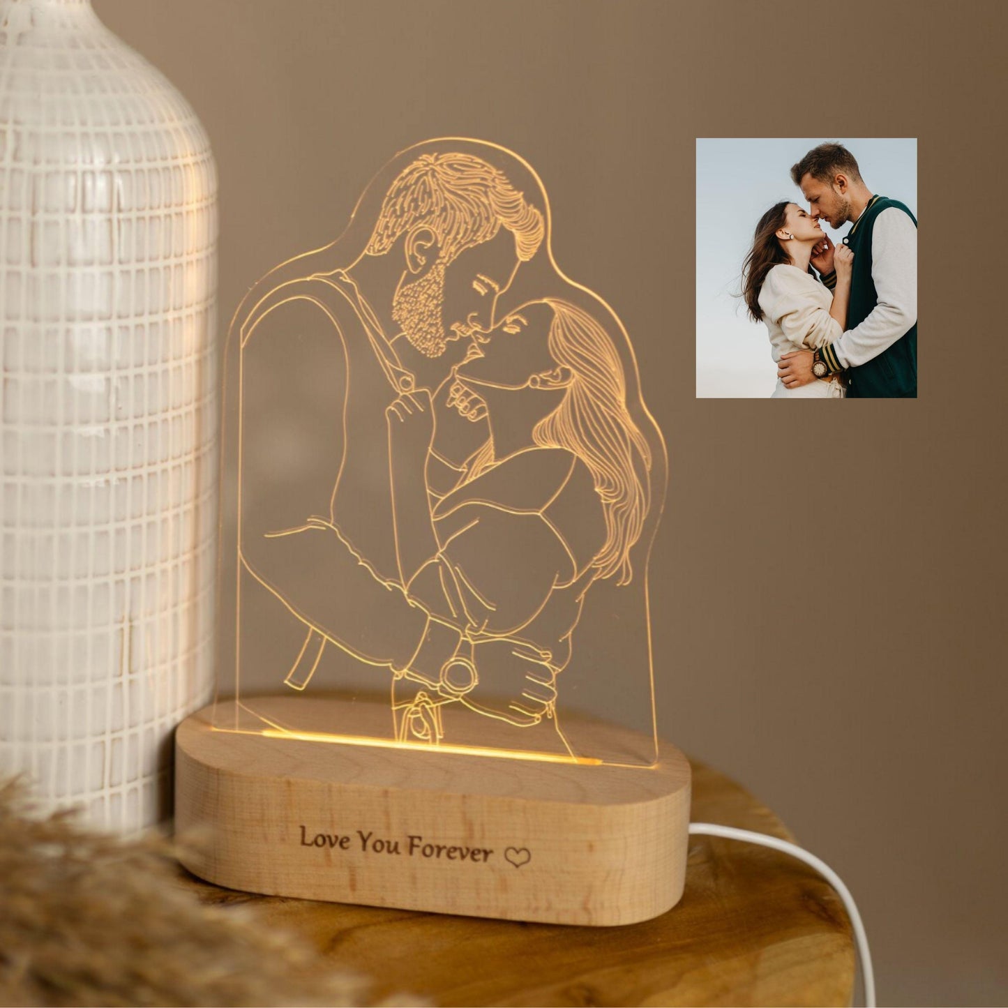 Personalised photo lamp with engraved portrait of a couple, softly light up