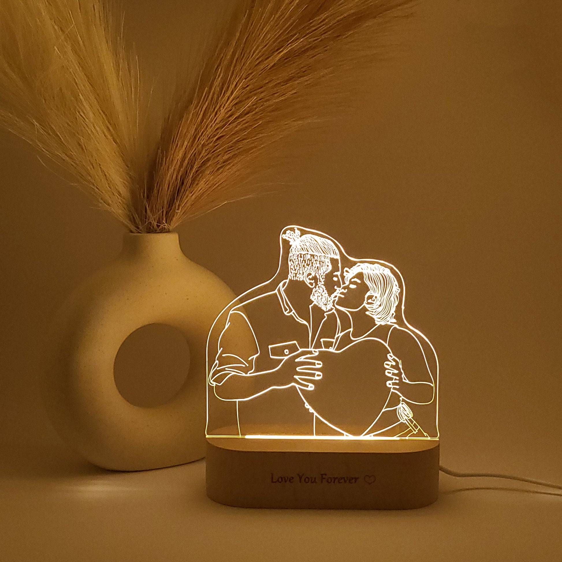 Personalized 3D lamp featuring a couple kissing in low light.