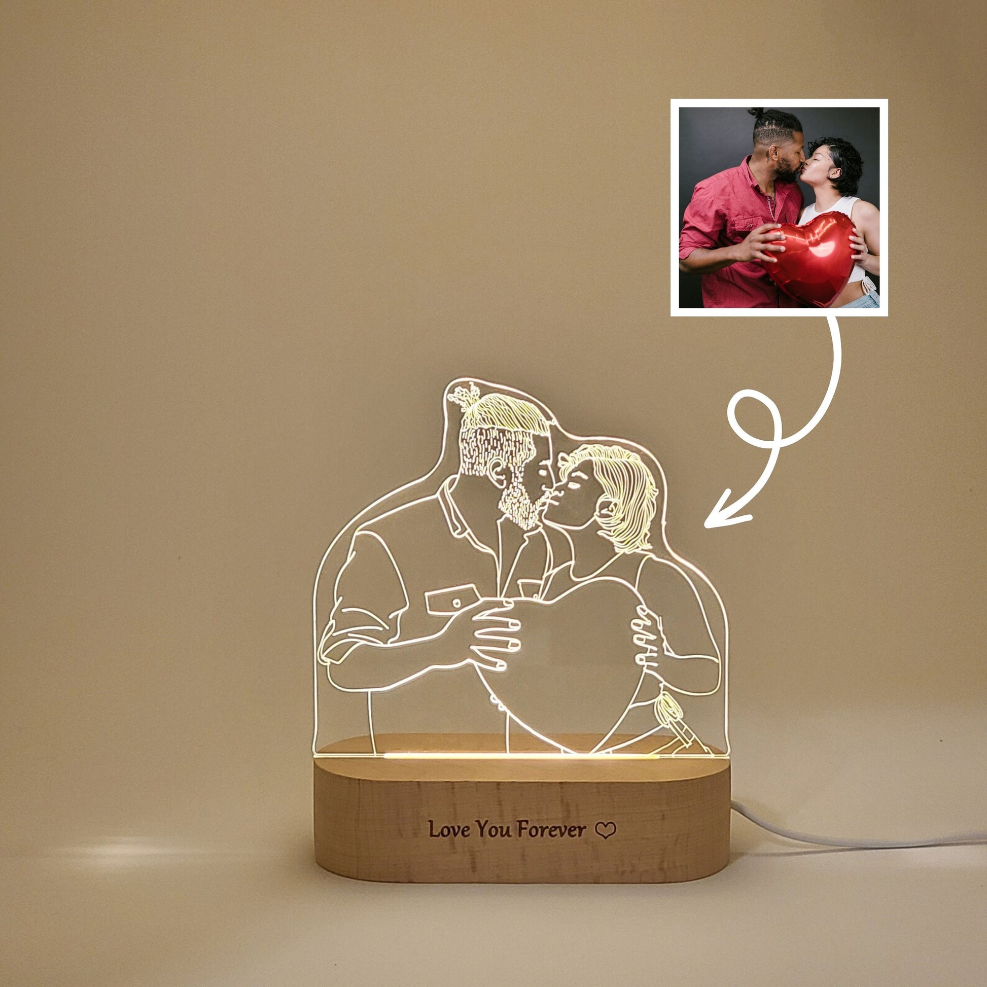 Personalized 3D lamp featuring a couple kissing in low light,showcasing the engraved image on the lamp.