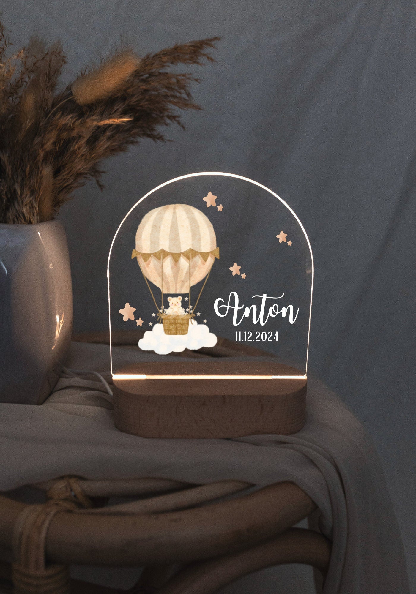Personalized Hot air balloon lamp, glowing softly in low light.