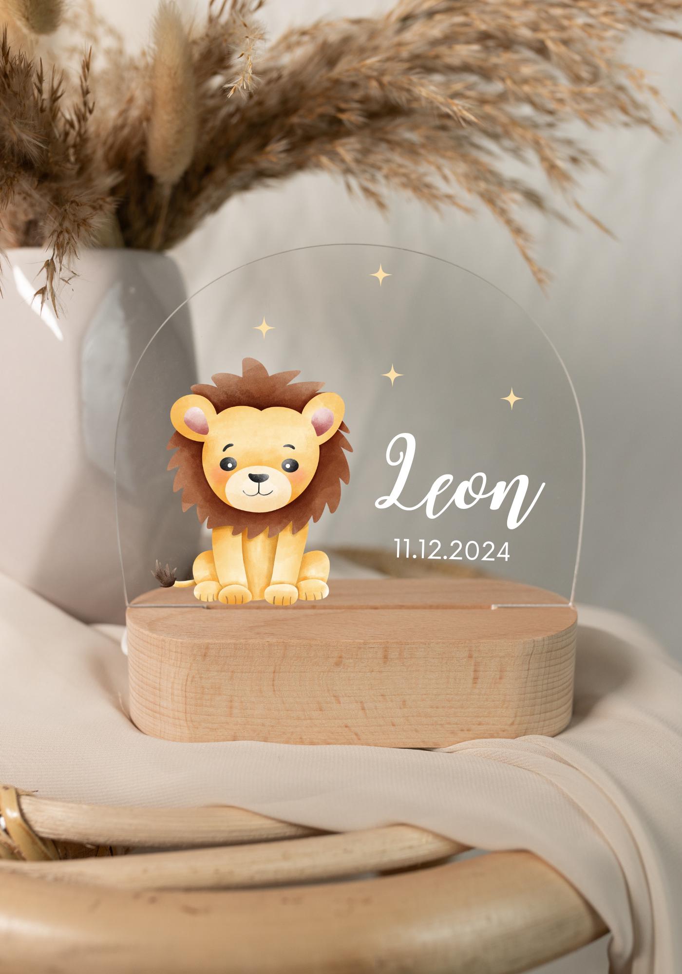 Personalized lion baby night light, captured in daylight with a close-up view, set against a boho-style background.
