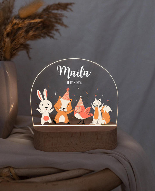 Personalized night light with an animal motif, baby lamp shown in a close-up view under low light.