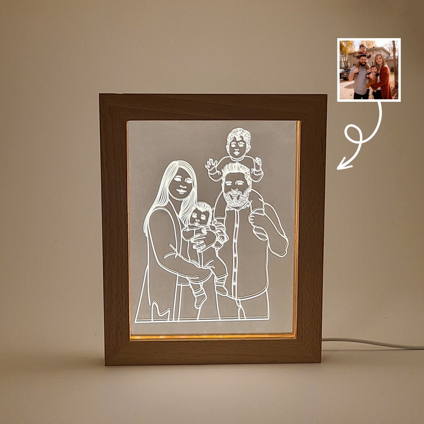 Personalized photo frames featuring an engraved family photo, displayed in low light, showcase the image before and after engraving.