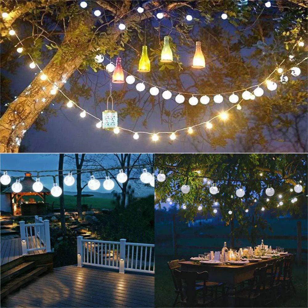 Outdoor light chain shaped like crystal balls, hanging on the patio.